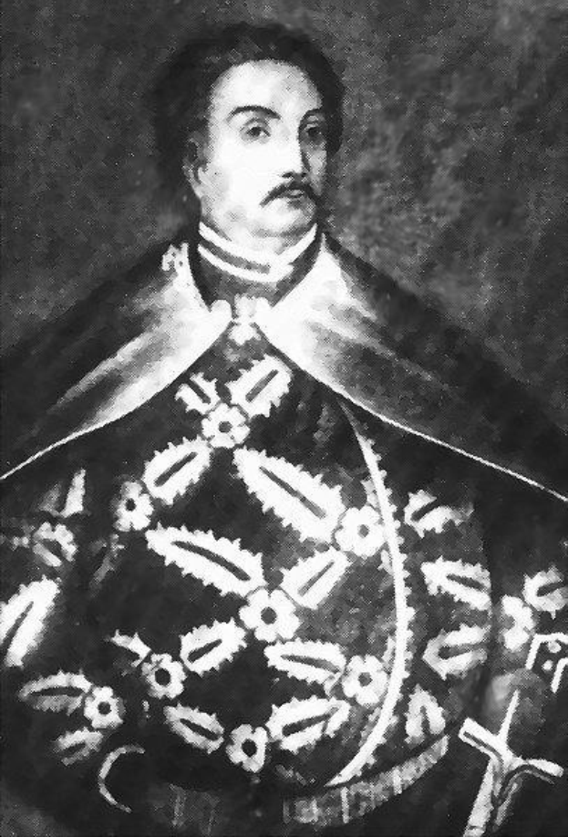 Schwarzes und weißes Foto von Papst Johannes Paul II. in Priesterrobe, der eine schwarze Robe mit weißem Kragen und Manschetten trägt und seine Hände falt, mit ernster Miene und direktem Blick.