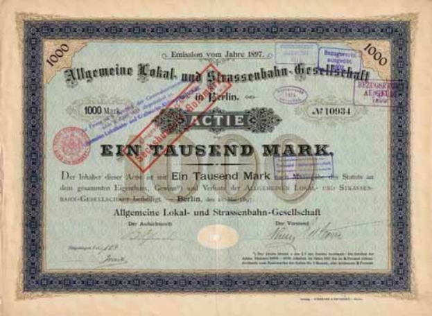 Deutsches Aktienzertifikat mit rotem Stempel und gedrucktem Text, wahrscheinlich zur Herkunft.