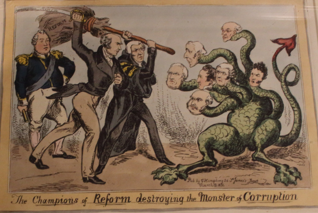 Cartoon-Illustration, die Figuren mit der Bezeichnung Reformchampions zeigt, die ein Monster mit der Bezeichnung Korruption angreifen, mit begleitendem Text, der lautet: "Die Reformchampions zerstören das Monster der Korruption."